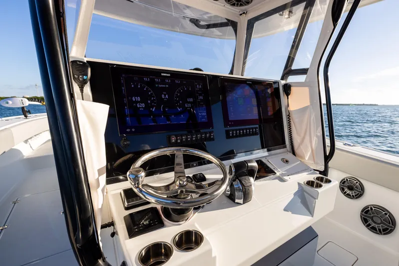  Yacht Photos Pics Freeman 37 VH 2020 boat dashboard with advanced navigation screens and steering wheel.