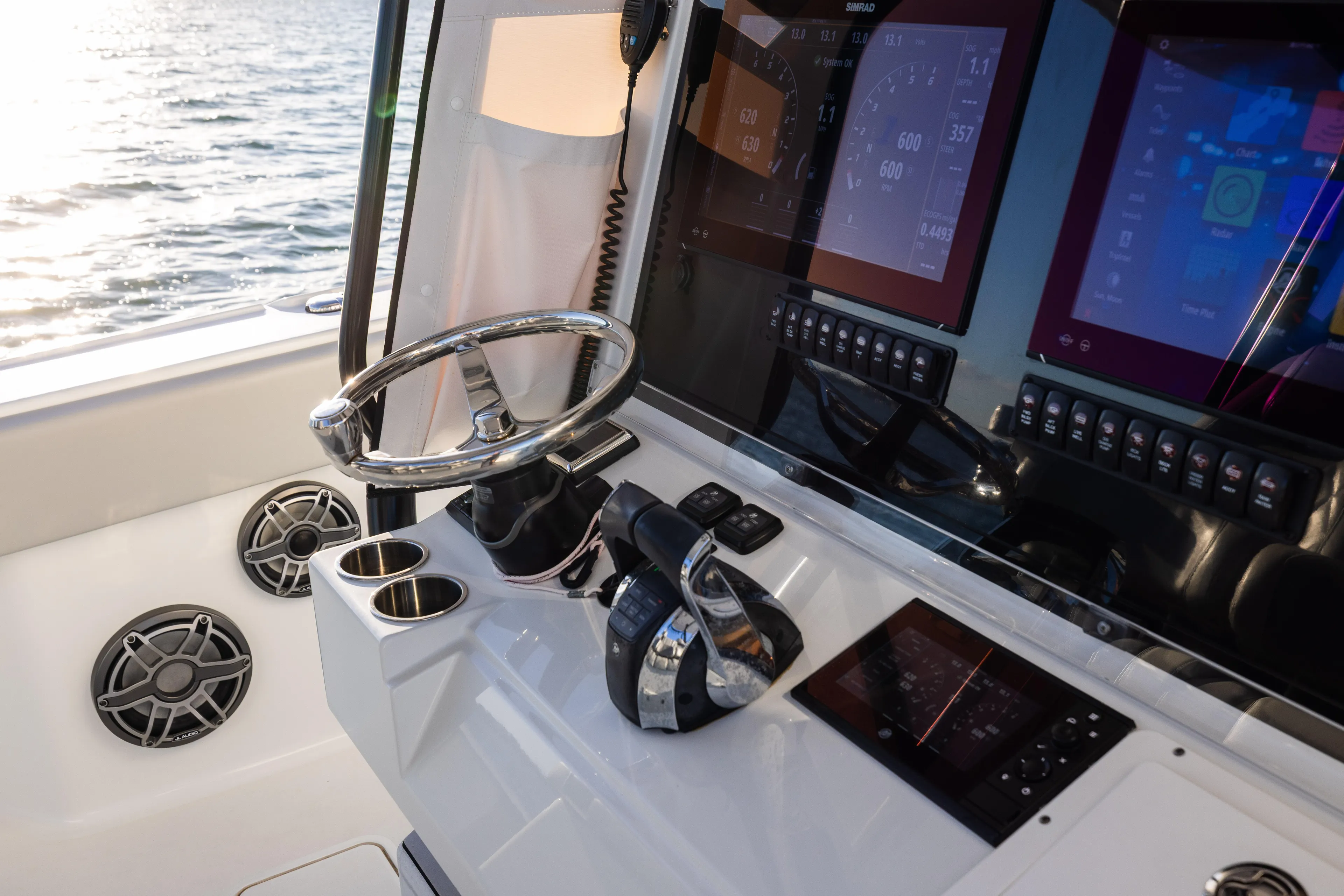  Yacht Photos Pics Helm of 2020 Freeman 37 VH boat with modern controls and displays.