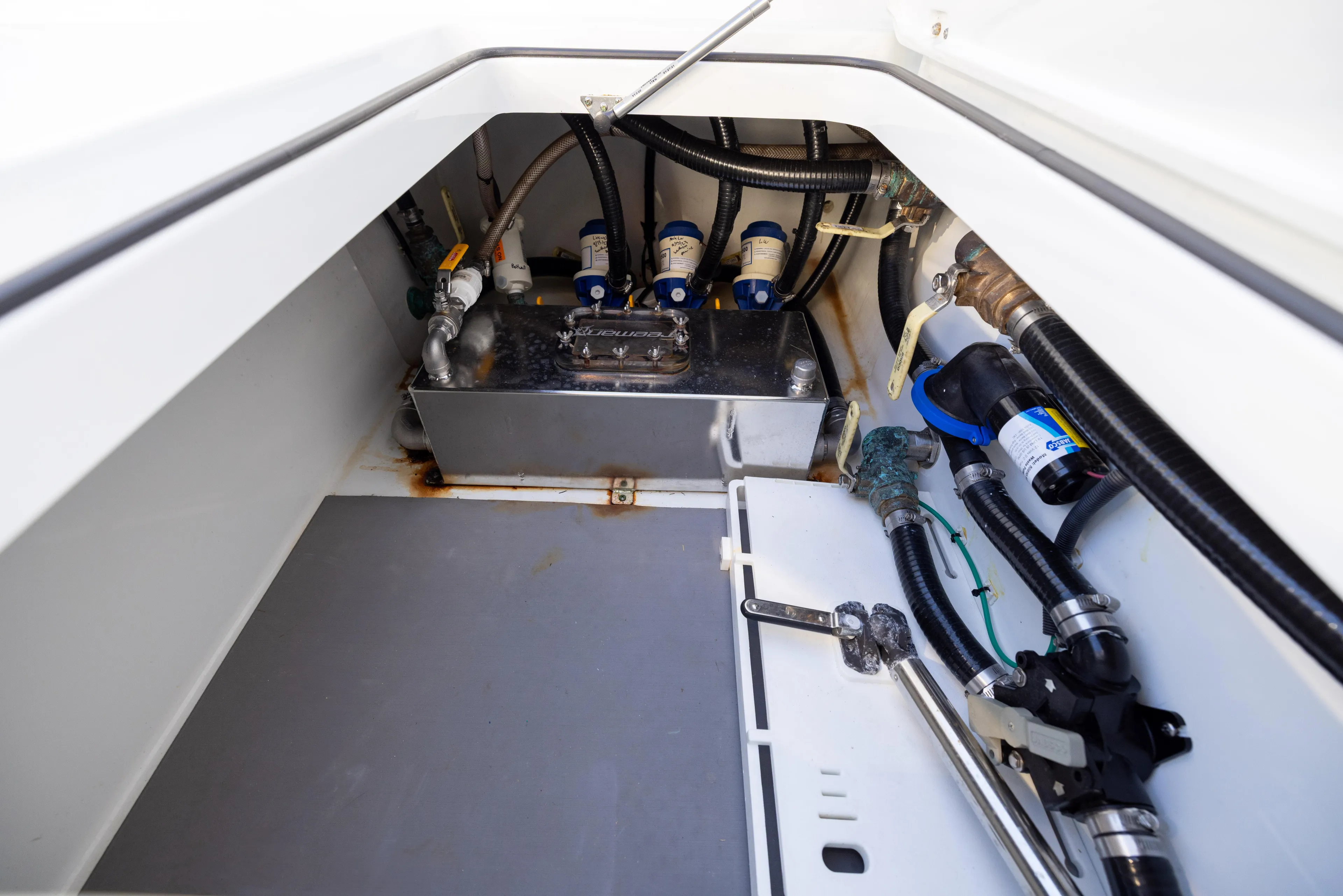  Yacht Photos Pics Freeman 37 VH 2020 boat compartment with mechanical components and hoses.