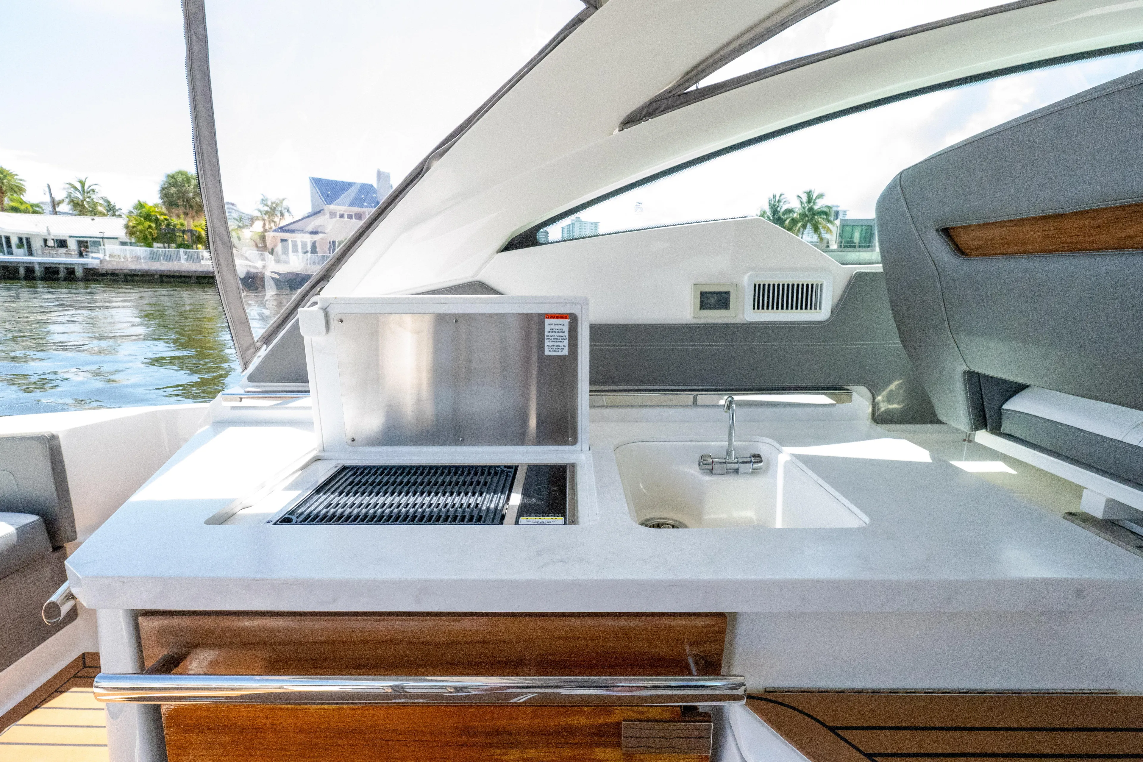  Yacht Photos Pics 2021 Tiara Sport 38 LX yacht interior with outdoor kitchen and sink.