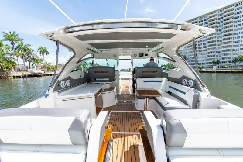  Yacht Photos Pics Luxurious 2021 Tiara Sport 38 LX yacht interior with elegant seating and waterfront view.