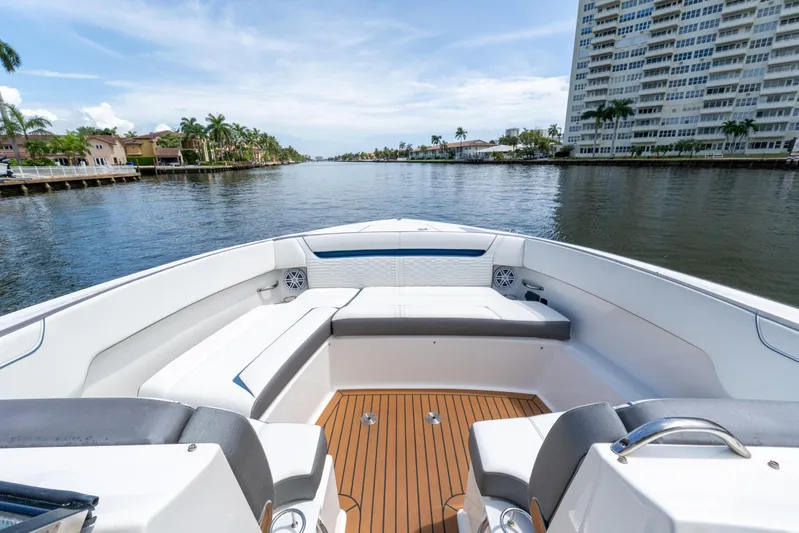  Yacht Photos Pics 2021 Tiara Sport 38 LX boat interior with waterfront view, featuring luxurious seating and modern design.