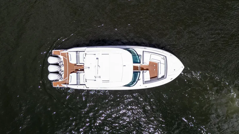 Yacht Photos Pics Aerial view of 2021 Tiara Sport 38 LX boat on water.