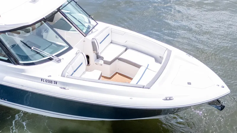  Yacht Photos Pics 2021 Tiara Sport 38 LX boat on water, featuring sleek design and spacious seating.