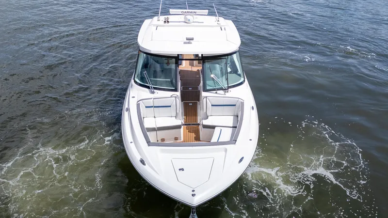  Yacht Photos Pics 2021 Tiara Sport 38 LX boat on water, aerial view, showcasing sleek design and spacious seating.