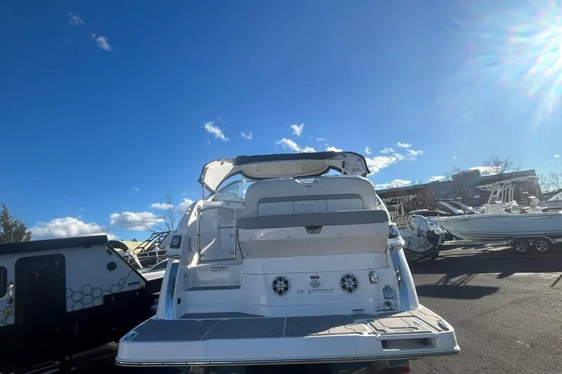  Yacht Photos Pics 2024 Regal 28 Express boat in a sunny outdoor setting, showcasing its sleek design.