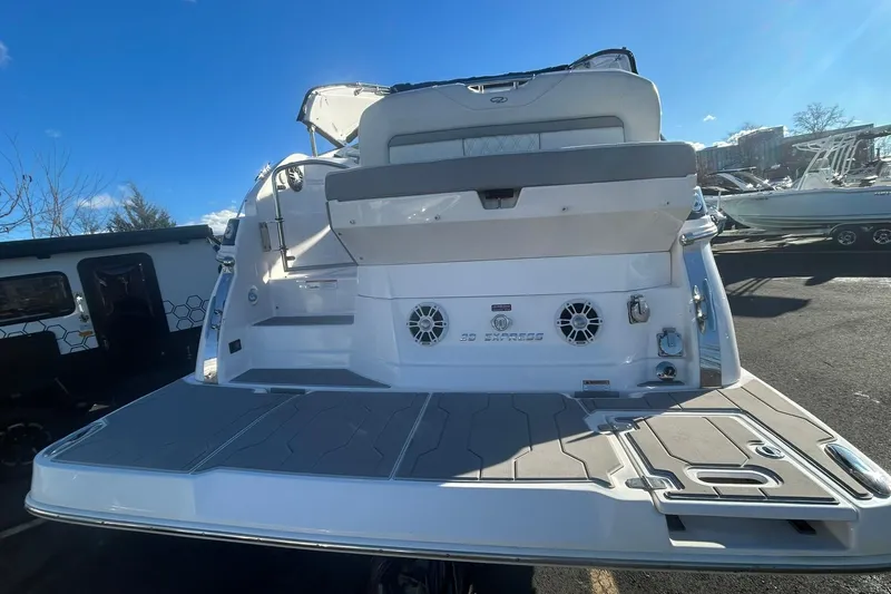  Yacht Photos Pics 2024 Regal 28 Express boat rear view with spacious deck and seating.