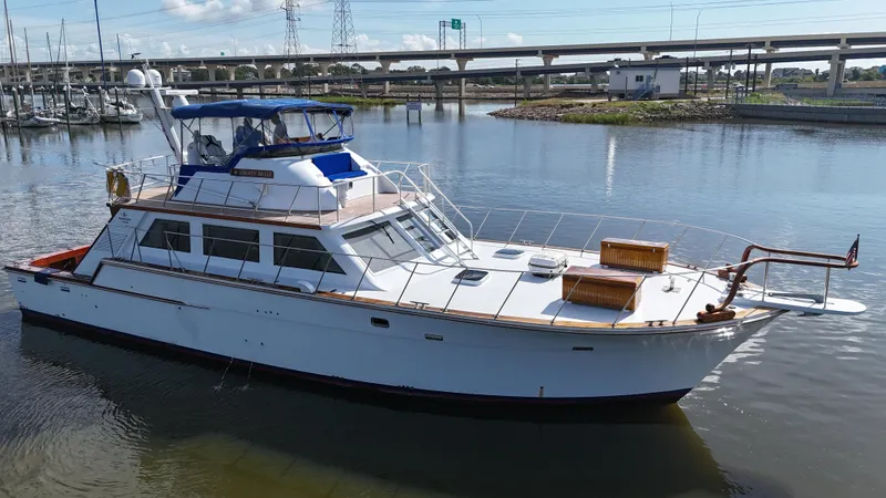 Liberty Belle Yacht Photos Pics 1980 Bertram 58 Convertible Custom yacht docked in a marina.