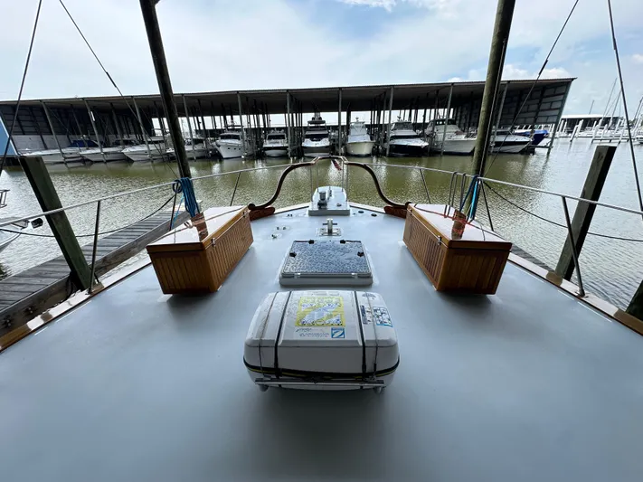Liberty Belle Yacht Photos Pics 1980 Bertram 58 Convertible Custom yacht deck view at marina.