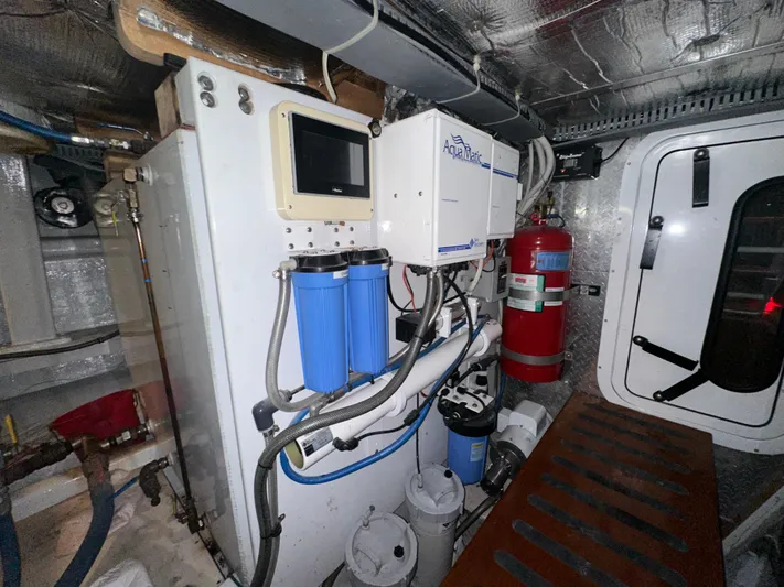 Liberty Belle Yacht Photos Pics Engine room of 1980 Bertram 58 Convertible Custom with water filtration system.