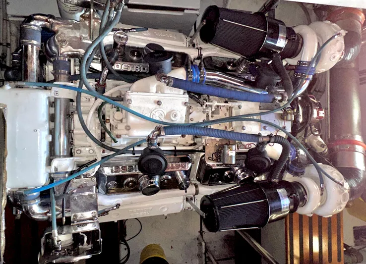 Liberty Belle Yacht Photos Pics Engine of a 1980 Bertram 58 Convertible Custom boat, showcasing intricate mechanical components.