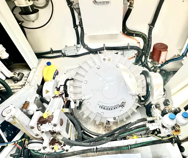 Liberty Belle Yacht Photos Pics Engine room of 1980 Bertram 58 Convertible Custom with Seakeeper stabilizer system.