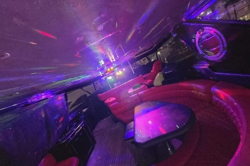  Yacht Photos Pics Luxurious 1999 Sea Ray 630 Sundancer interior with vibrant lighting and plush red seating.