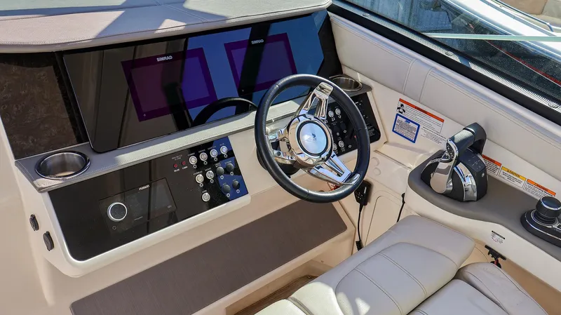 4743jg Yacht Photos Pics Interior helm of 2021 Sea Ray 320 Sundancer with modern controls and steering wheel.