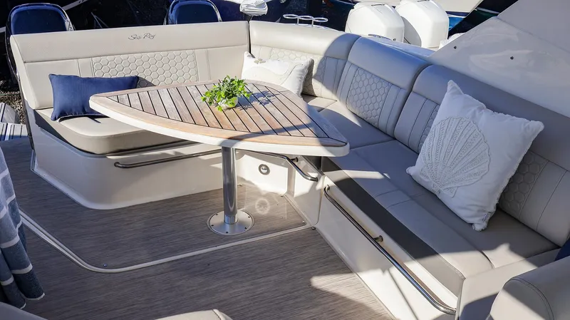 4743jg Yacht Photos Pics Luxurious seating area on 2021 Sea Ray 320 Sundancer yacht with elegant cushions and table.
