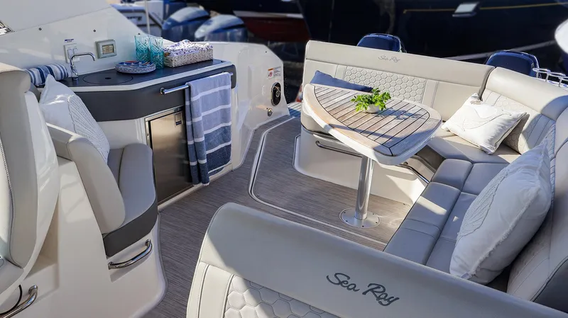 4743jg Yacht Photos Pics Luxurious interior of 2021 Sea Ray 320 Sundancer yacht with elegant seating and table.