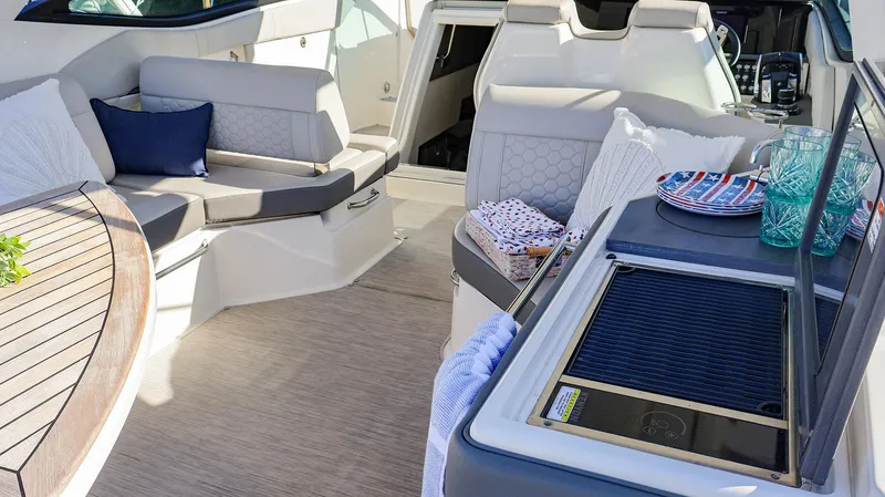 4743jg Yacht Photos Pics Luxurious 2021 Sea Ray 320 Sundancer interior with seating and kitchenette.