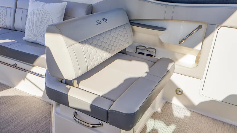 4743jg Yacht Photos Pics Luxurious seating on 2021 Sea Ray 320 Sundancer boat with elegant upholstery and cup holders.