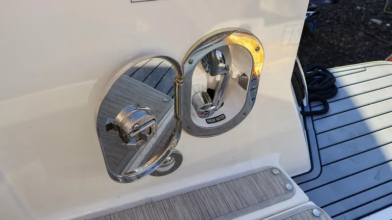 4743jg Yacht Photos Pics 2021 Sea Ray 320 Sundancer fuel cap on deck, stainless steel finish.