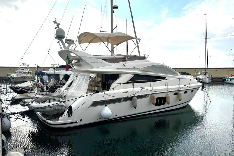 My Law Yacht Photos Pics 2007 Fairline Phantom 48 yacht docked in marina, side view.