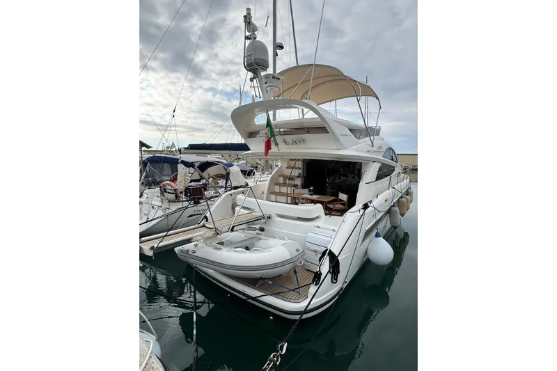 My Law Yacht Photos Pics 2007 Fairline Phantom 48 yacht docked, featuring spacious deck and elegant design.