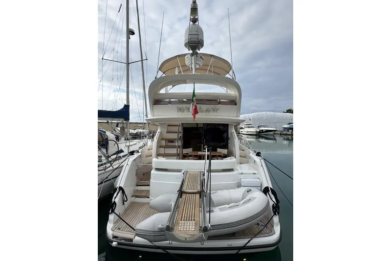 My Law Yacht Photos Pics 2007 Fairline Phantom 48 yacht docked at marina, rear view with inflatable boat.