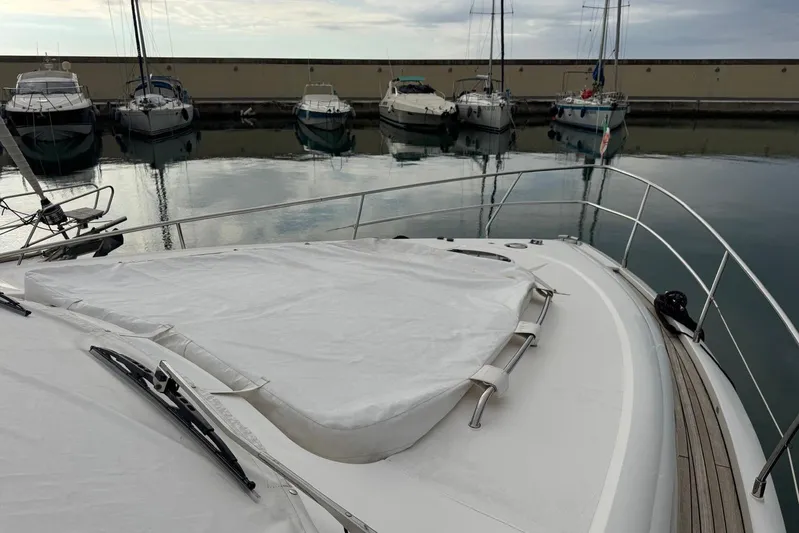 My Law Yacht Photos Pics 2007 Fairline Phantom 48 yacht docked in a marina, surrounded by other boats.