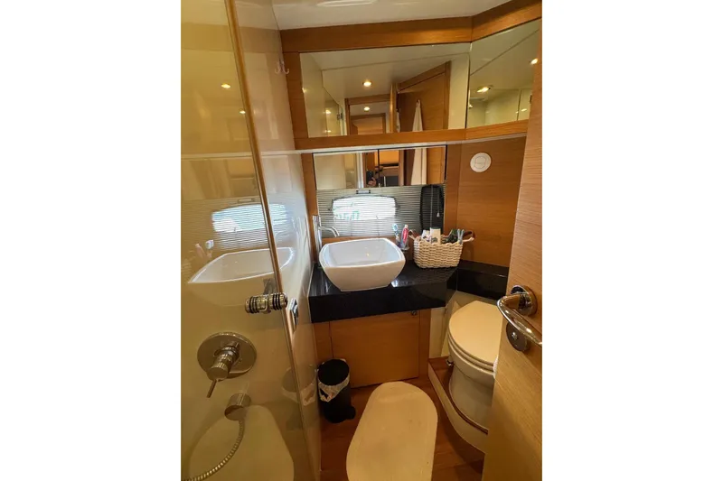 My Law Yacht Photos Pics Luxurious bathroom in 2007 Fairline Phantom 48 yacht with modern fixtures and elegant design.