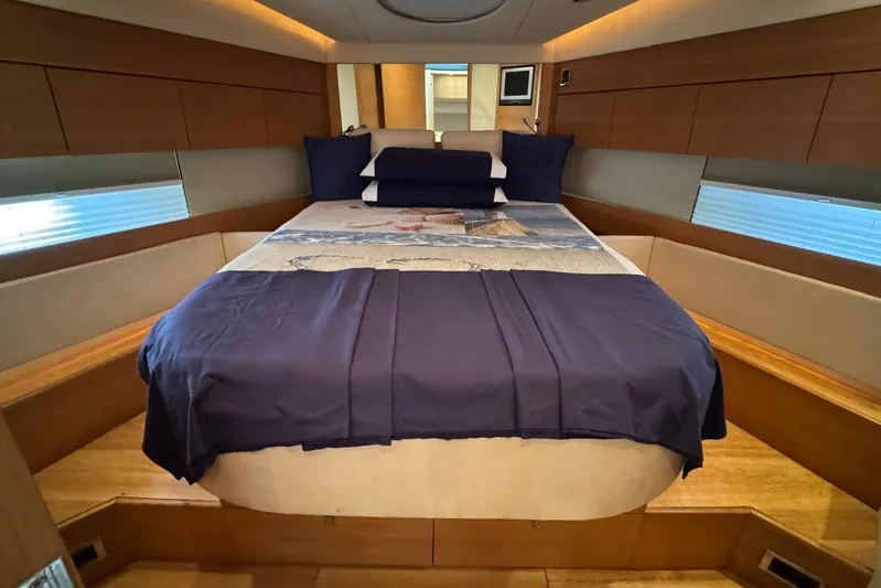My Law Yacht Photos Pics Luxurious bedroom interior of 2007 Fairline Phantom 48 yacht with elegant bedding.
