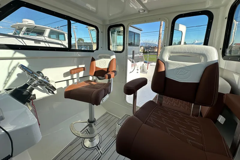  Yacht Photos Pics Interior of 2026 Parker 227 Explorer boat with brown and white seating.