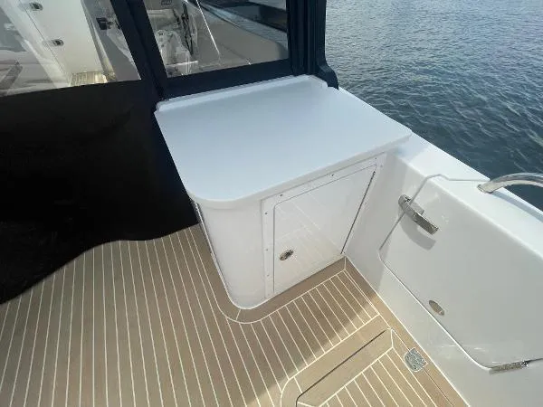 2025 Mjm Yacht Photos Pics 2025 MJM MJM3 boat deck with sleek white cabinetry and wood-patterned flooring.