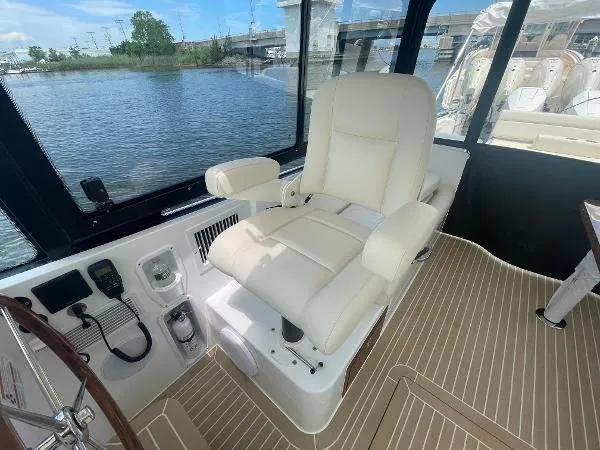 2025 Mjm Yacht Photos Pics Luxurious captain's chair on 2025 MJM MJM3 boat, overlooking serene waters.