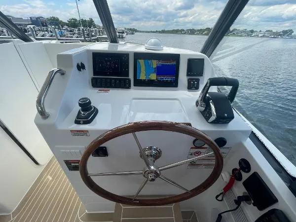 2025 Mjm Yacht Photos Pics Helm of 2025 MJM MJM3 boat with navigation screens and steering wheel.
