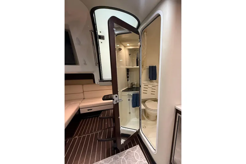Wanderlust Yacht Photos Pics Interior of 2015 Monterey 355 Sport Yacht featuring bathroom and seating area.