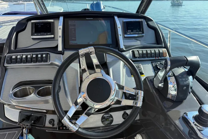 Wanderlust Yacht Photos Pics Cockpit of 2015 Monterey 355 Sport Yacht with modern controls and steering wheel.