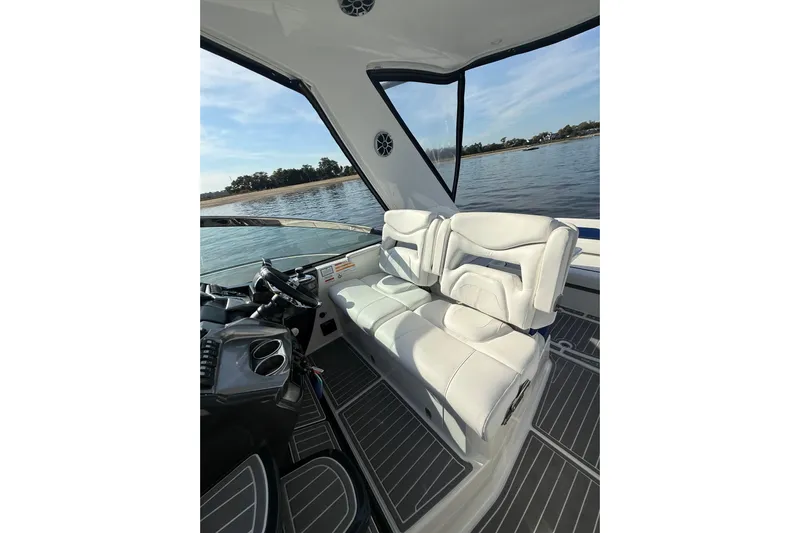 Wanderlust Yacht Photos Pics Interior of 2015 Monterey 355 Sport Yacht with white seating and scenic water view.