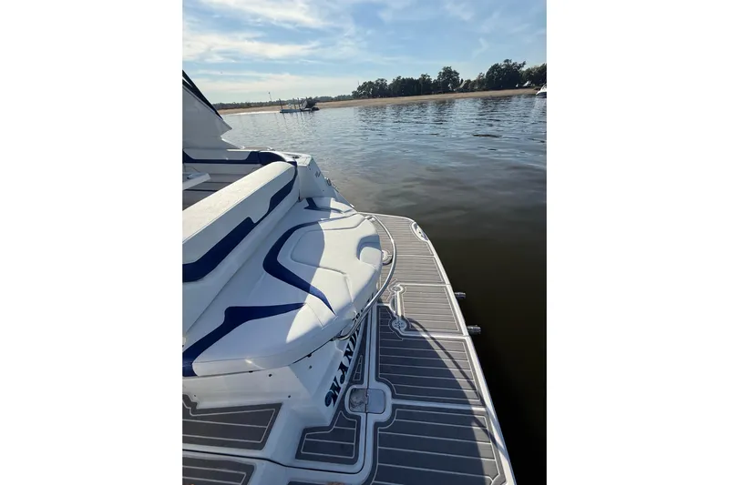 Wanderlust Yacht Photos Pics 2015 Monterey 355 Sport Yacht on calm water, featuring sleek deck design.
