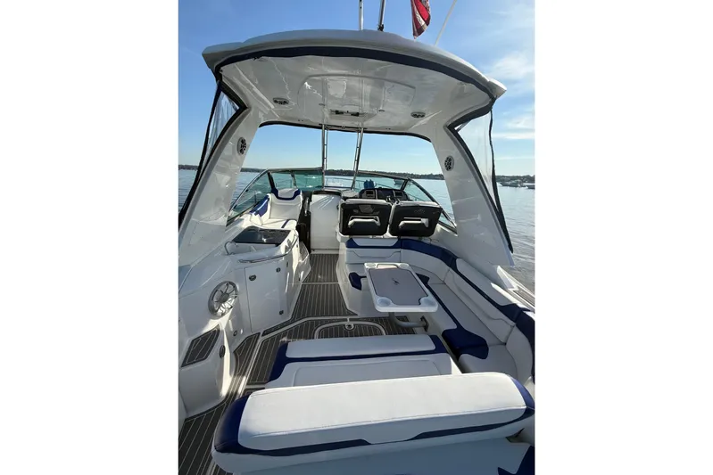 Wanderlust Yacht Photos Pics 2015 Monterey 355 Sport Yacht interior with seating and table on calm water.