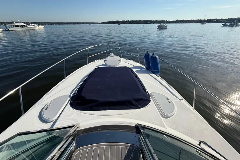 Wanderlust Yacht Photos Pics 2015 Monterey 355 Sport Yacht on calm water, showcasing sleek deck design.