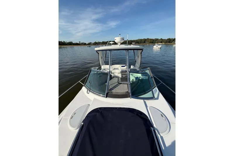 Wanderlust Yacht Photos Pics 2015 Monterey 355 Sport Yacht on calm water, showcasing sleek design and spacious deck.
