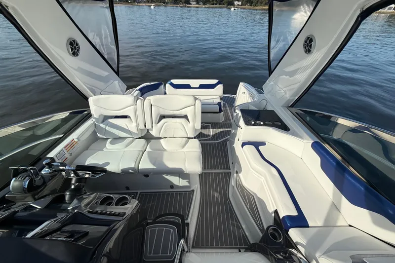 Wanderlust Yacht Photos Pics 2015 Monterey 355 Sport Yacht interior with white seating and sleek design on calm water.