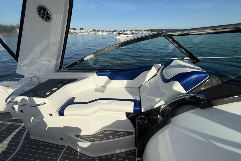 Wanderlust Yacht Photos Pics 2015 Monterey 355 Sport Yacht interior with blue and white seating, docked on calm water.