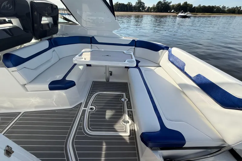Wanderlust Yacht Photos Pics Luxurious seating area on a 2015 Monterey 355 Sport Yacht, featuring blue and white upholstery.