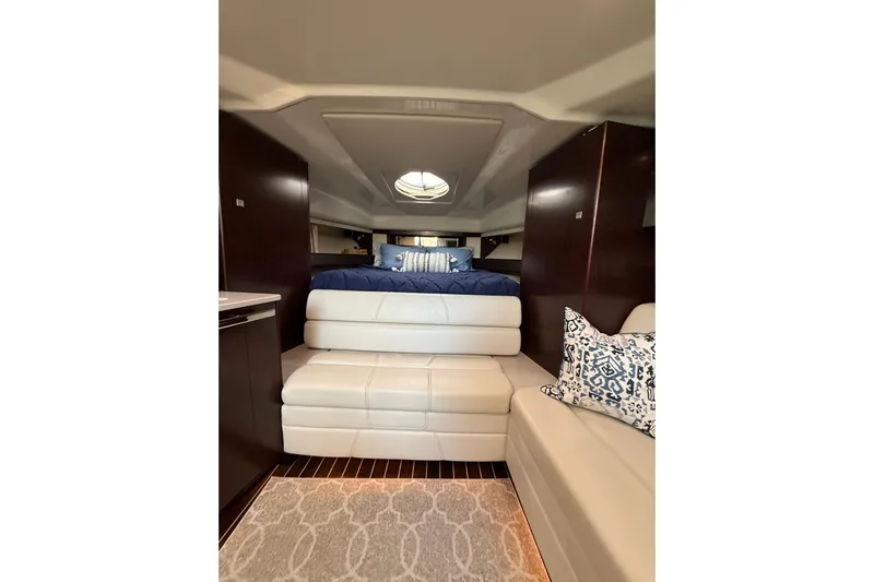 Wanderlust Yacht Photos Pics Luxurious interior of 2015 Monterey 355 Sport Yacht with elegant seating and bedding.