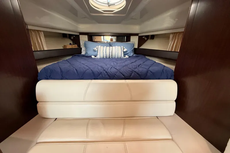 Wanderlust Yacht Photos Pics Luxurious interior of 2015 Monterey 355 Sport Yacht with cozy bed and elegant decor.