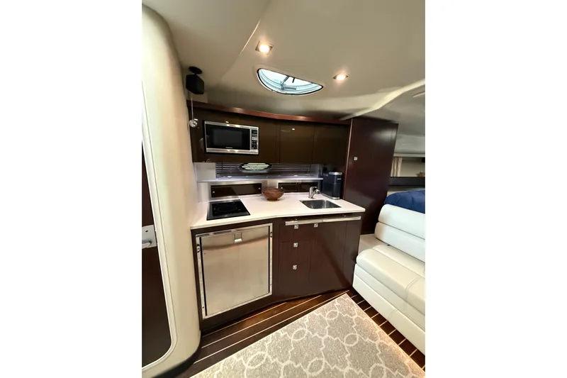 Wanderlust Yacht Photos Pics Luxurious 2015 Monterey 355 Sport Yacht interior kitchen with modern amenities.