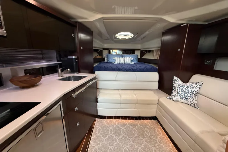 Wanderlust Yacht Photos Pics Luxurious interior of 2015 Monterey 355 Sport Yacht with modern kitchen and cozy seating.