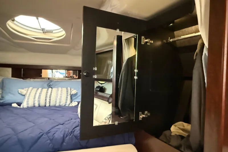 Wanderlust Yacht Photos Pics Interior of 2015 Monterey 355 Sport Yacht with bed and mirrored closet.