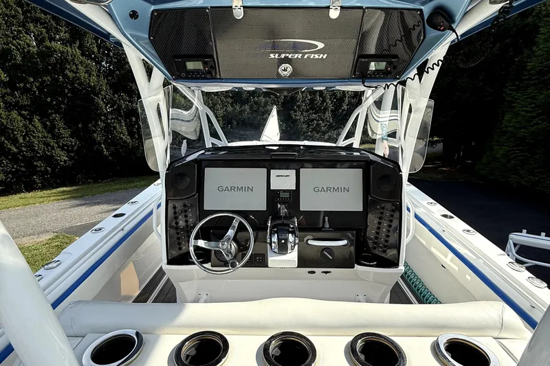  Yacht Photos Pics 2017 Nor-Tech 392 Superfish boat cockpit with Garmin navigation system and steering wheel.