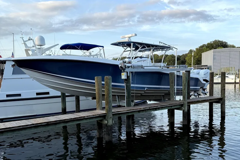  Yacht Photos Pics 2017 Nor-Tech 392 Superfish boat docked at marina, blue hull, calm water.
